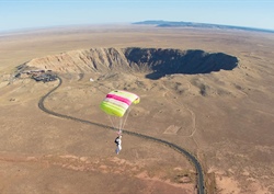 Skydivers Jump Over Meteor Crater