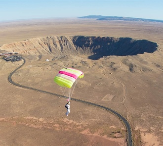 Skydivers Jump Over Meteor Crater