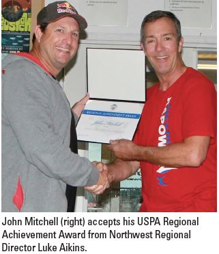 Aikins Presents Regional Award to John Mitchell