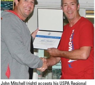 Aikins Presents Regional Award to John Mitchell